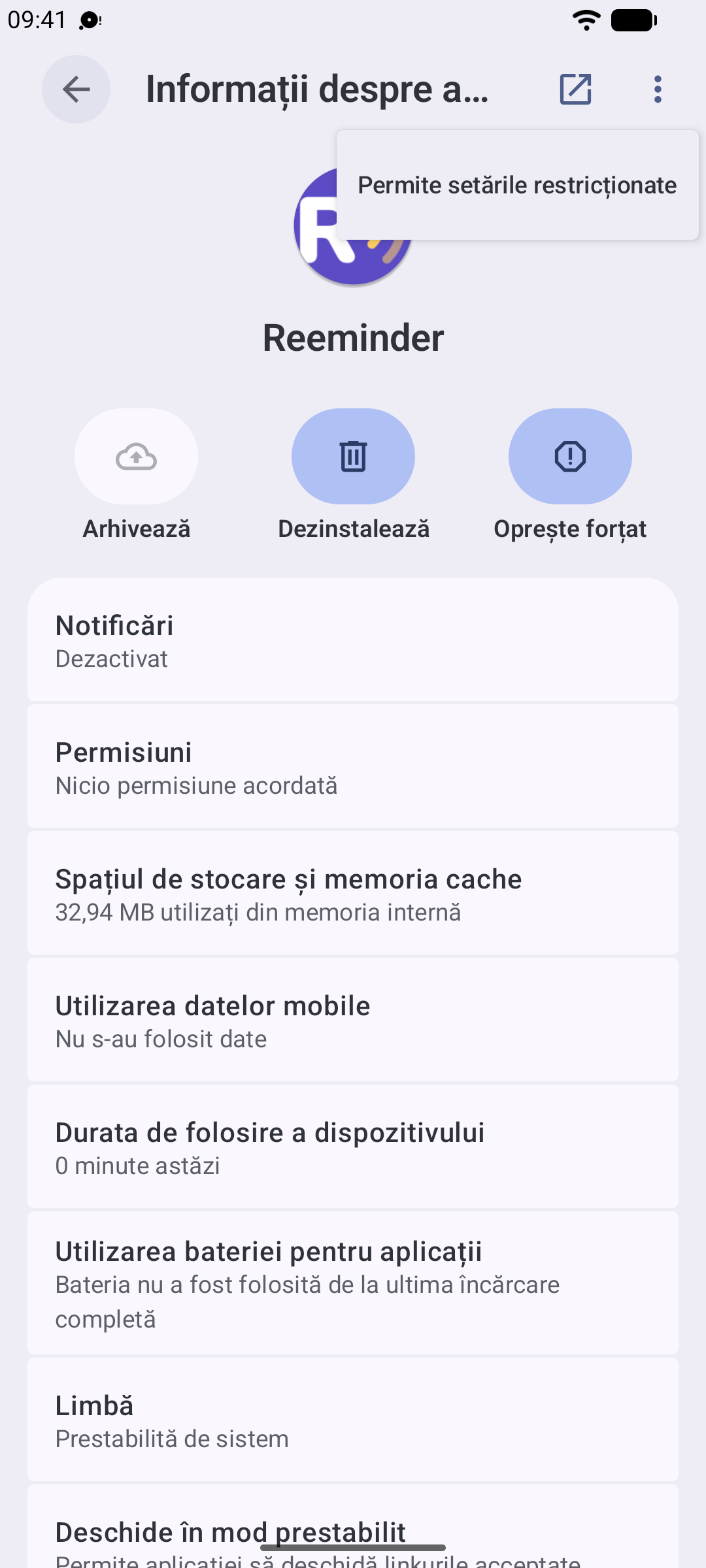 Meniul cu trei puncte deschis, cu „Permiteți setările restricționate” evidențiat